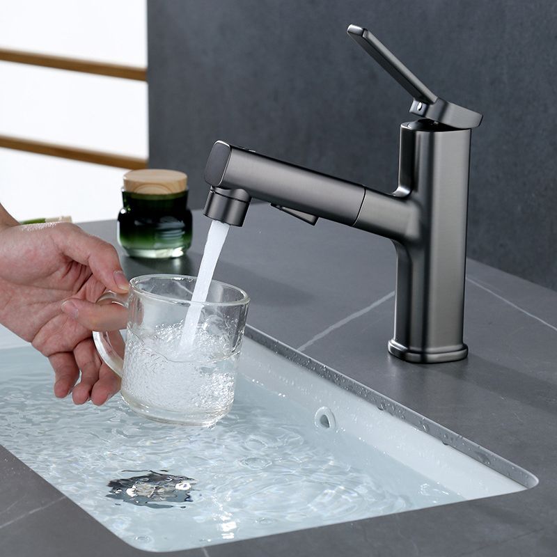 BowLift | Modern bathroom sink faucet with brass lever handles and swivel spout