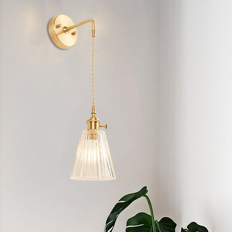 BowLift | A wall light with a bulb and conical shade made of clear, textured glass, industrial bedroom wall light fixture