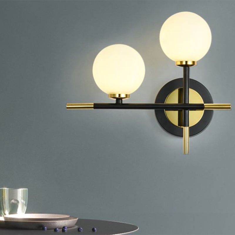 BowLift | Milk glass orb wall light with cross design 2 lights modern black and brass wall light