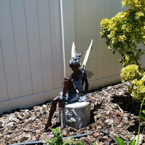 BowLift | Statue of sitting fairy in the garden