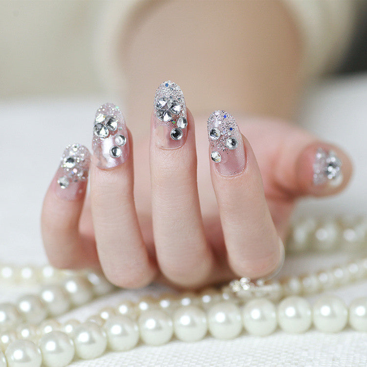 Sparkling artificial nails with rhinestones and sparkling accents Bowlift