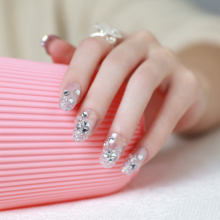 Sparkling artificial nails with rhinestones and sparkling accents Bowlift