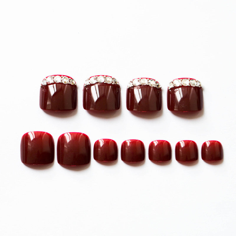 Artful toenails with elegant rhinestone decorations Bowlift