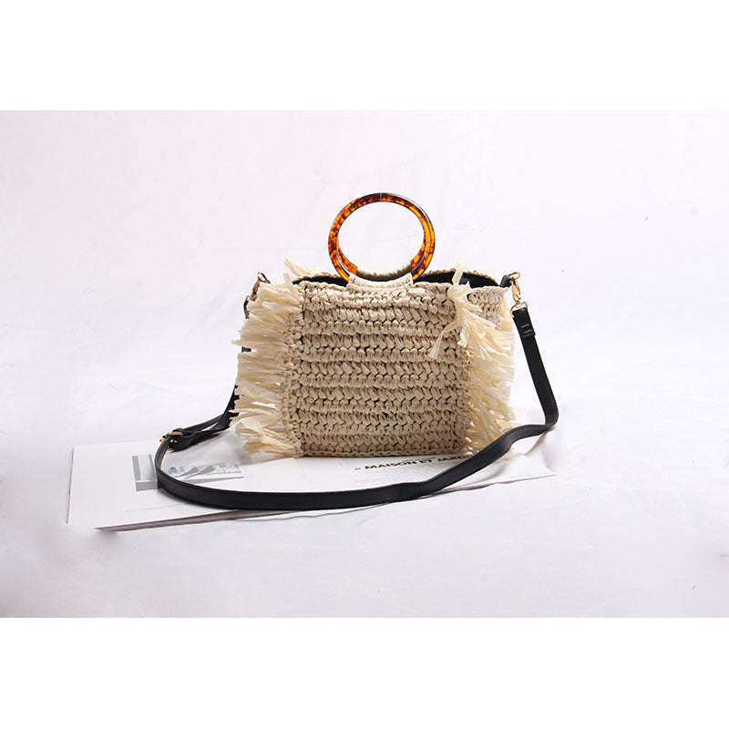 Handmade raffia shoulder bag with fringed accents Bowlift