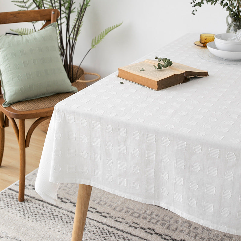 Tablecloth made of cotton blend with embossed square and circle relief Bowlift