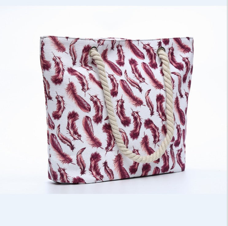 Beach bag with playful feather pattern Bowlift
