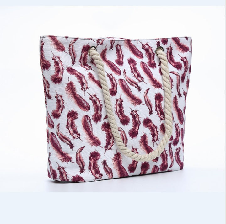 Beach bag with playful feather pattern Bowlift