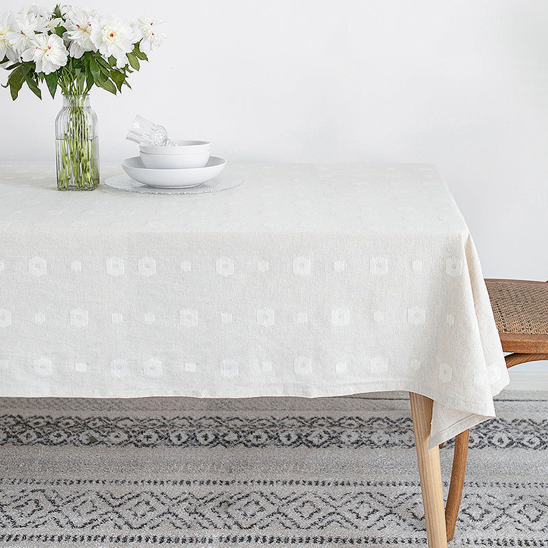 Tablecloth made of cotton blend with embossed square and circle relief Bowlift