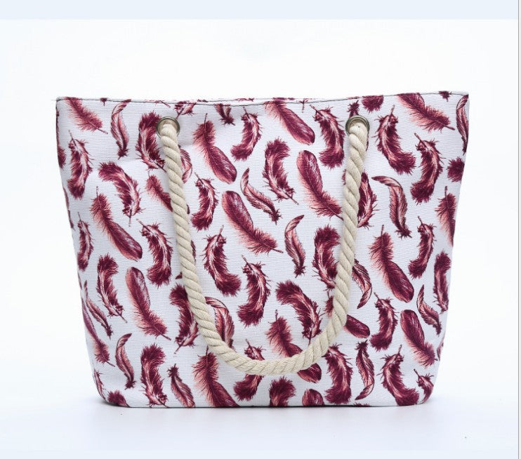 Beach bag with playful feather pattern Bowlift