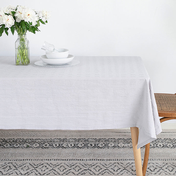 Tablecloth made of cotton blend with embossed square and circle relief Bowlift