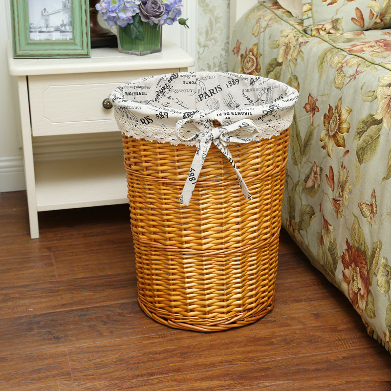 Women's laundry basket made of woven natural material with decorative fabric lining Bowlift