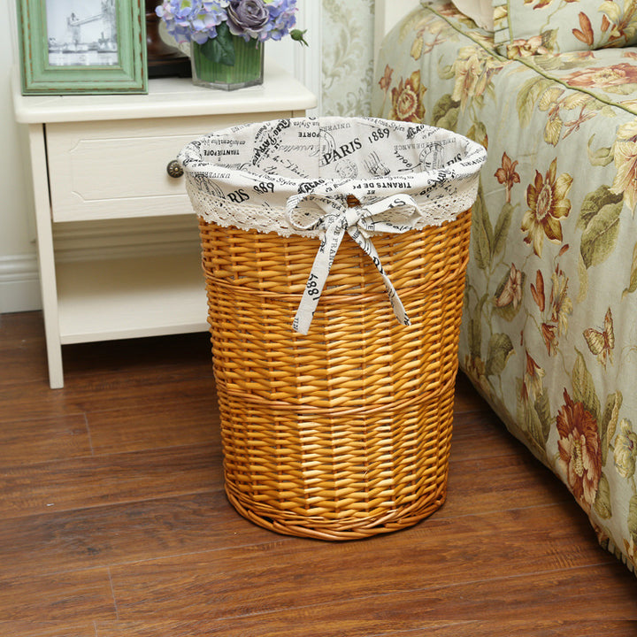 Women's laundry basket made of woven natural material with decorative fabric lining Bowlift