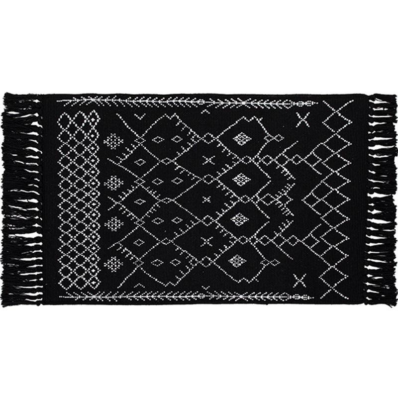 Woven cotton rug runner with flat weave structure, graphic diamond ethnic pattern and fringes