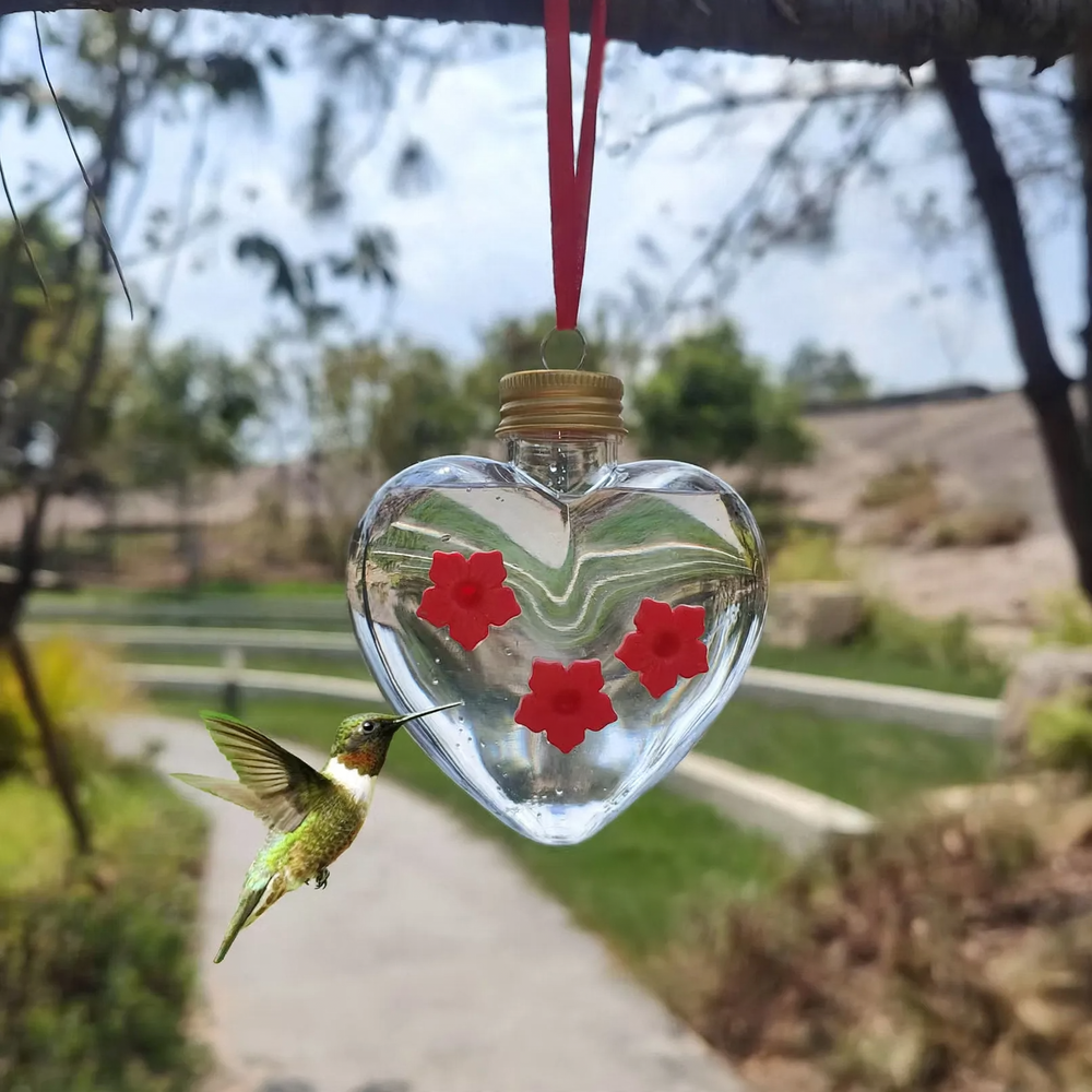 Ball-shaped bird waterer for outdoor use