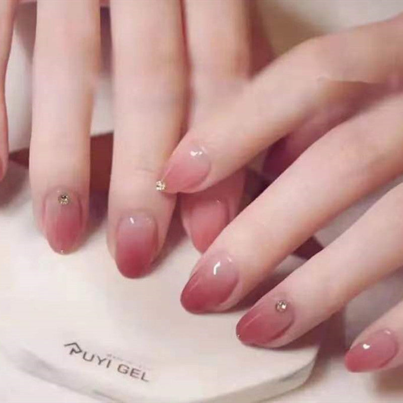 Artificial nails with elegant ombre effect and rhinestone decorations Bowlift
