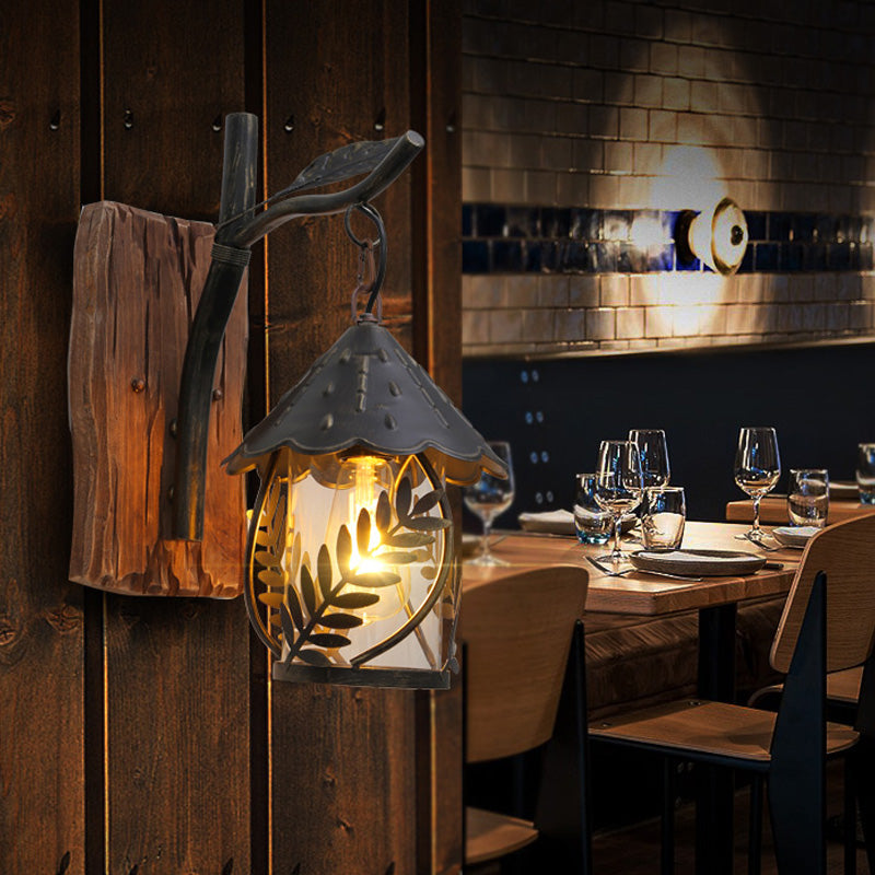 BowLift | A wall lamp with a glass bulb and cylindrical shade made of clear glass, industrial wall lamp for the living room with leaf branch in black