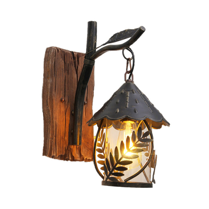 BowLift | A wall lamp with a glass bulb and cylindrical shade made of clear glass, industrial wall lamp for the living room with leaf branch in black