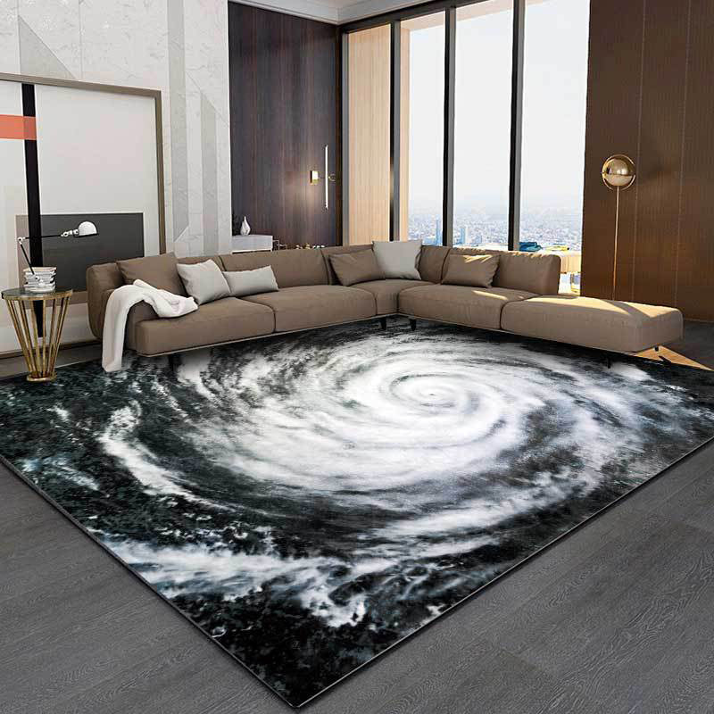 Modern living room carpet in black and white with a print of the Typhoon Eye from space, plush carpet, non-slip area rug | Bowlift