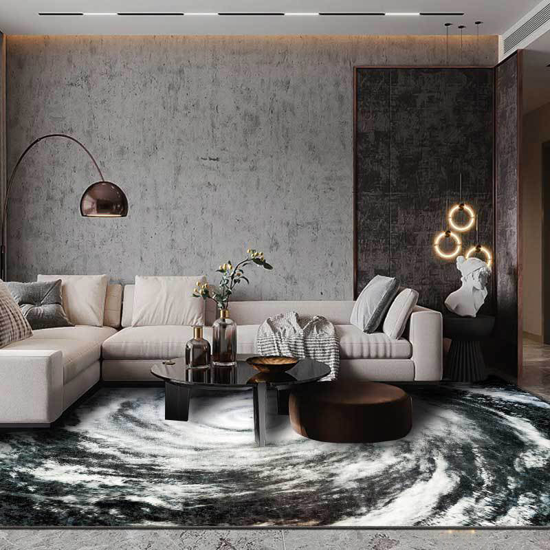 Modern living room carpet in black and white with a print of the Typhoon Eye from space, plush carpet, non-slip area rug | Bowlift