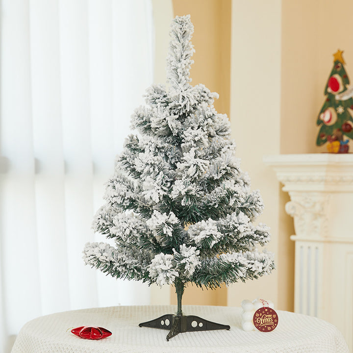 Flocked mini Christmas tree, festive table decoration