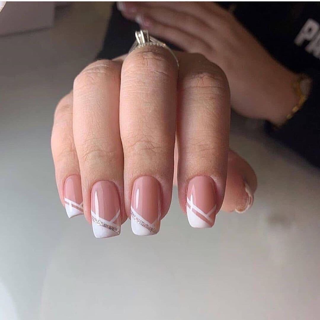 Artful nail design with elegant French tip and glitter accents Bowlift