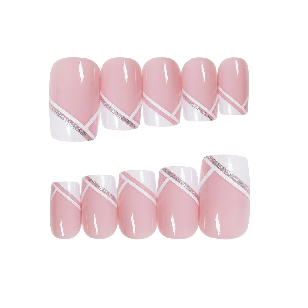 Artful nail design with elegant French tip and glitter accents Bowlift