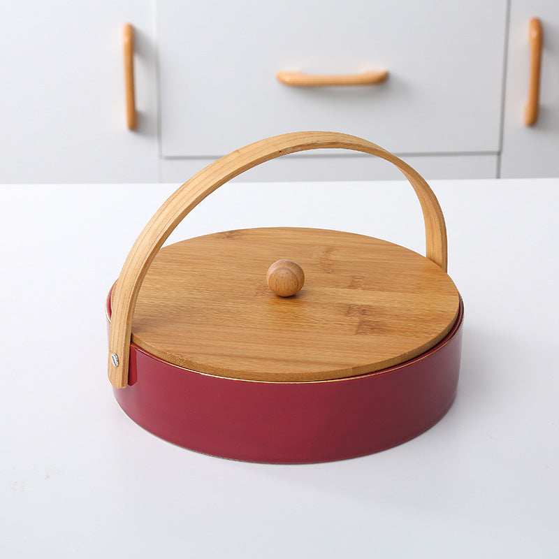 Round serving and storage set with bamboo handle and three-part interior divider