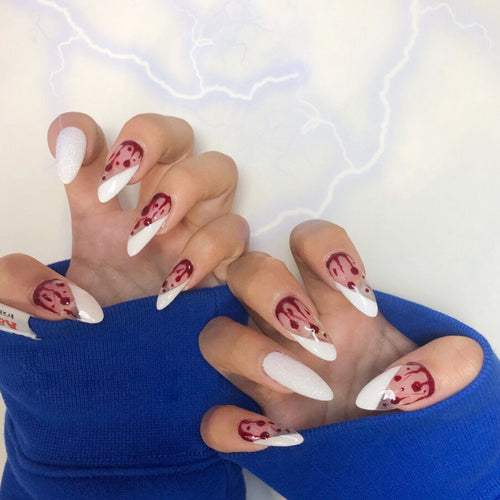 Artistic acrylic nails with elegant flower and glitter accents Bowlift