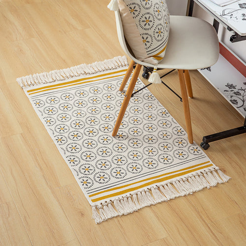 Flat woven cotton runner with fringes and graphic medallion pattern