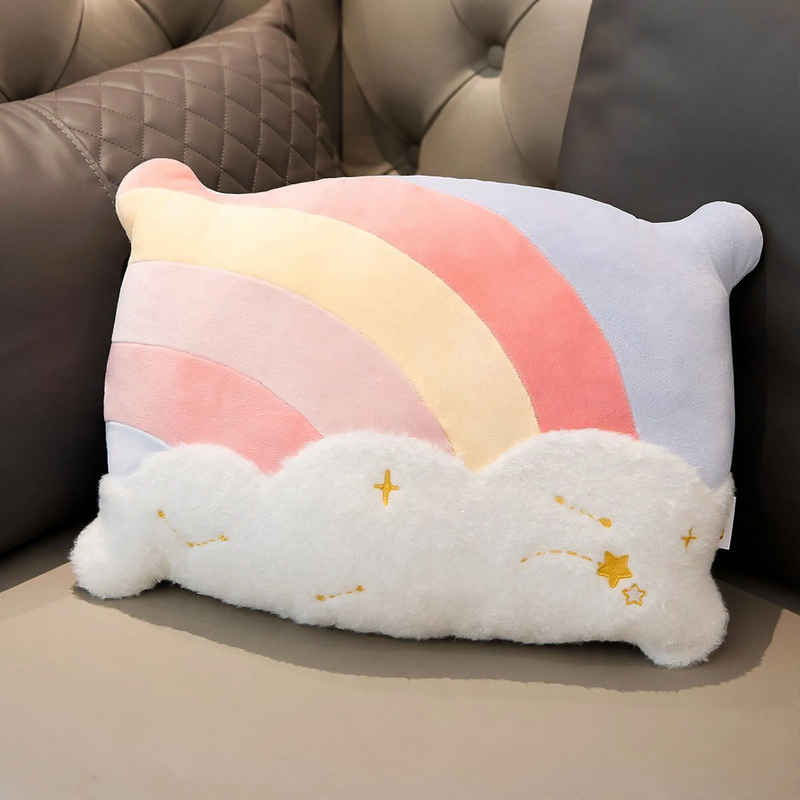 Plush pillow with star and rainbow motifs