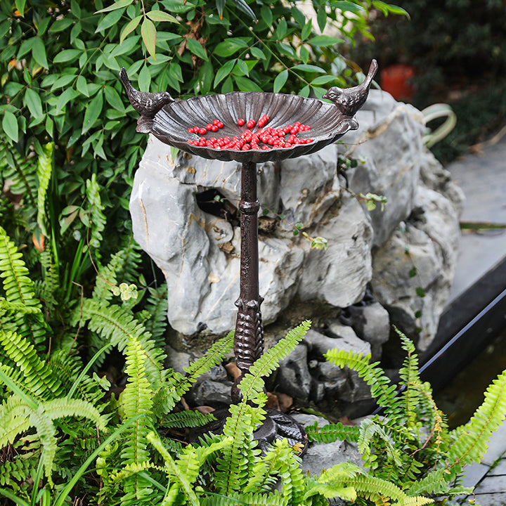 Antique cast iron birdbath on stand
