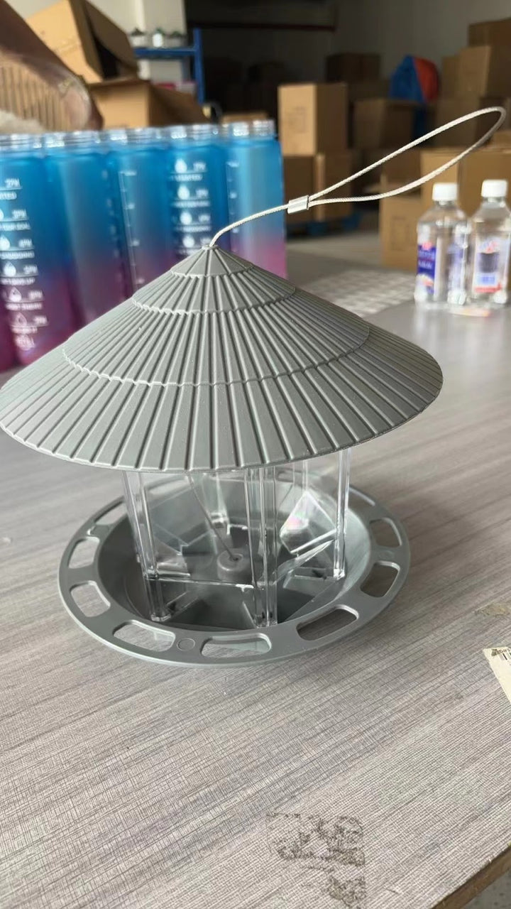 Hanging bird feeder for outdoor use