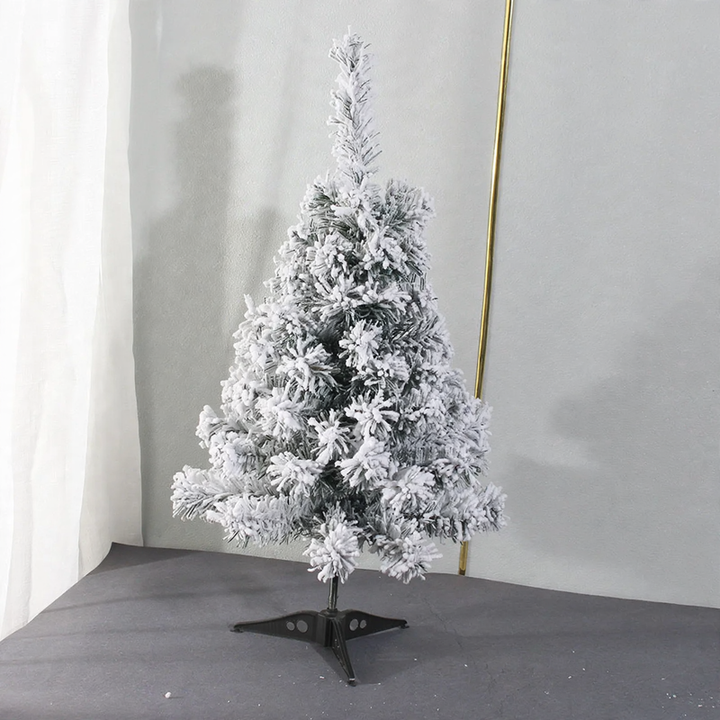 Mini Christmas tree for the table, snow-covered, with lighting