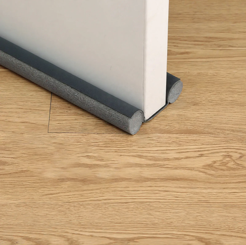 Door bottom seal for sound and draft protection