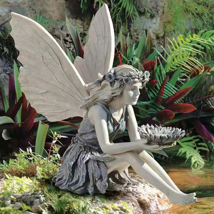 Decorative English figure as a birdbath for the garden
