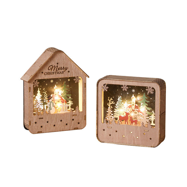 Illuminated wooden house with LED Christmas decoration