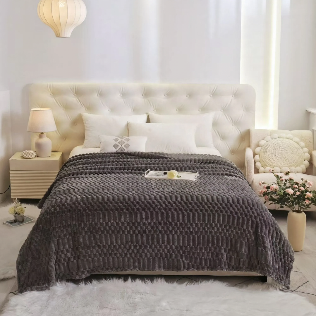 Versatile living blanket with jacquard pattern