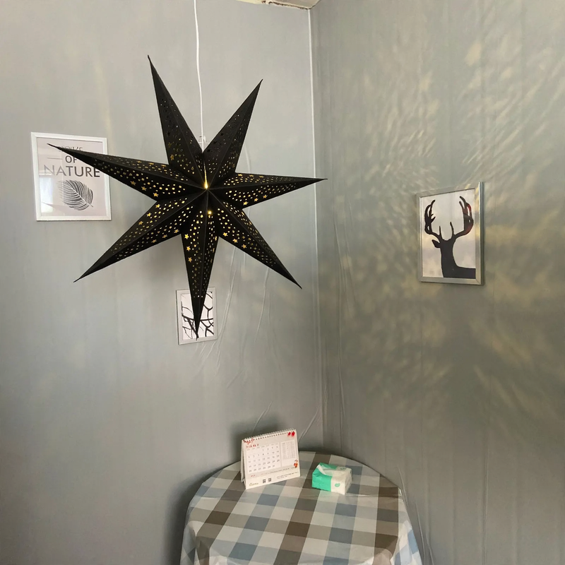 Decorative star pendant light made of parchment, iron frame