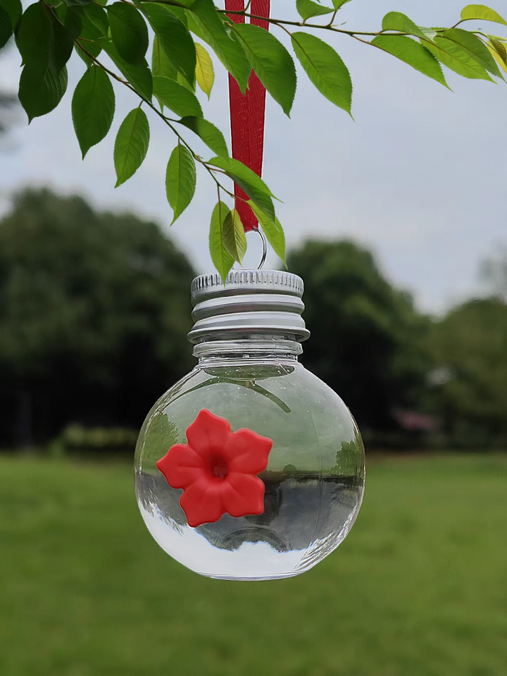 Ball-shaped bird waterer for outdoor use