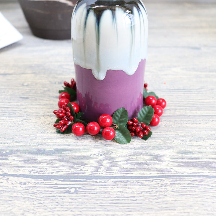 Christmas candle wreath with red berries