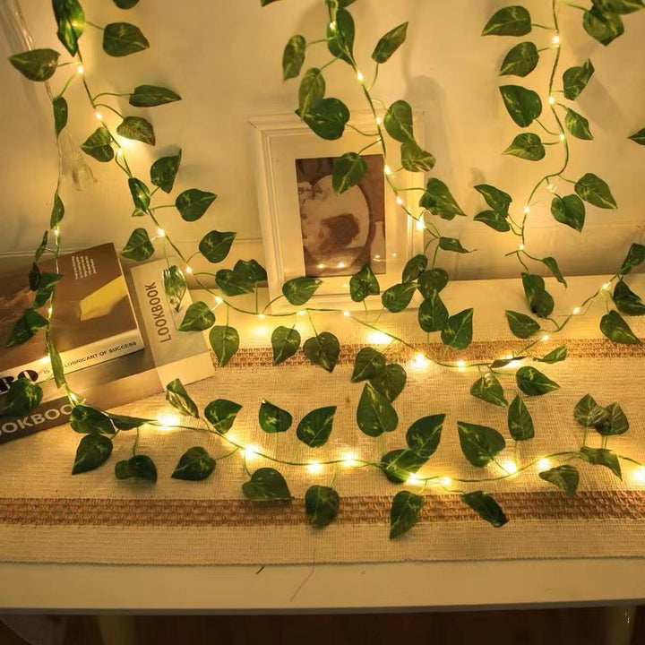LED string lights with artificial plant vines
