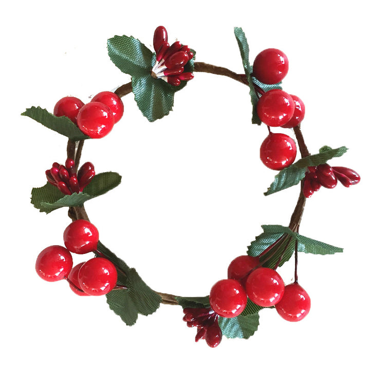 Christmas candle wreath with red berries