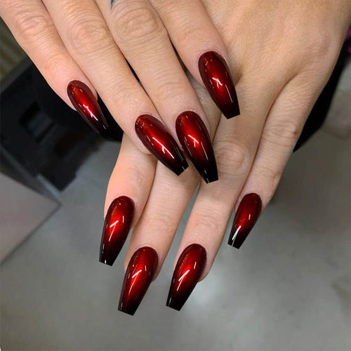 Artificial nail art in elegant stiletto design with glossy gradient colors Bowlift