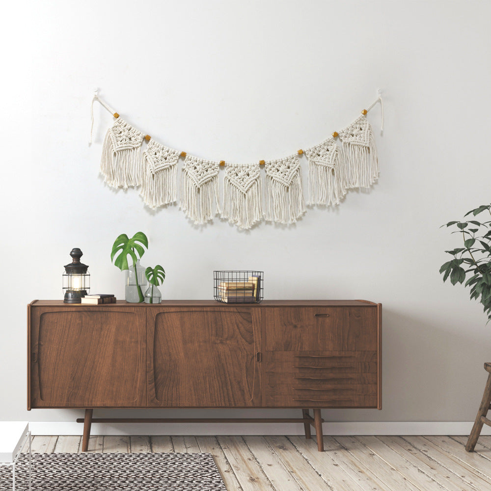 Decorative macrame wall hanging with ornate fringes