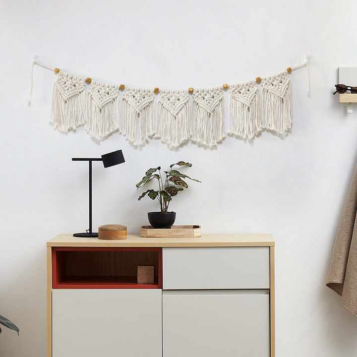 Decorative macrame wall hanging with ornate fringes