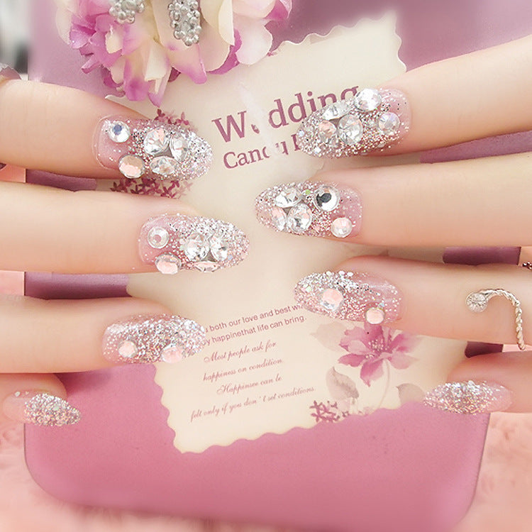 Artificials nails with sparkling rhinestone accents and elegant flower embellishments Bowlift