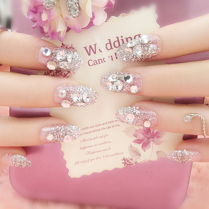 Artificials nails with sparkling rhinestone accents and elegant flower embellishments Bowlift