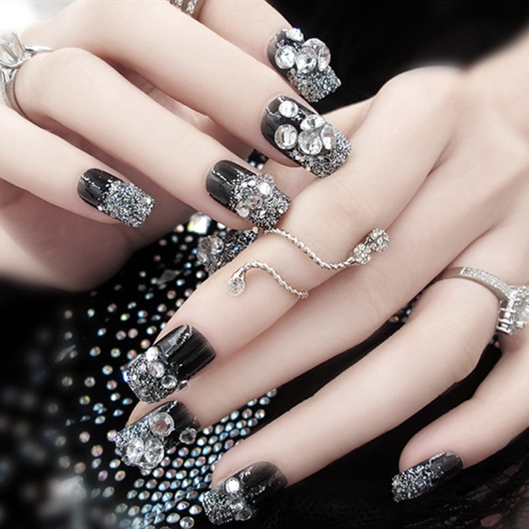 Artificials nails with sparkling rhinestone accents and elegant flower embellishments Bowlift