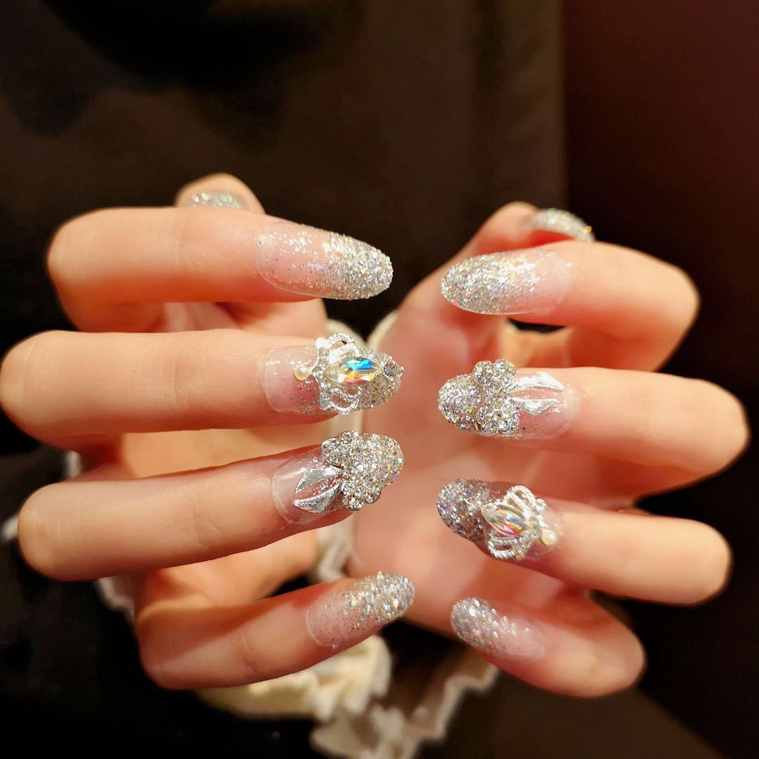 Nail art with sparkling rhinestone and glitter accents Bowlift