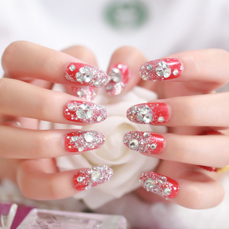 Artificials nails with sparkling rhinestone accents and elegant flower embellishments Bowlift